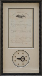 Custom framed naturalization documents with buttons and mouth harp
