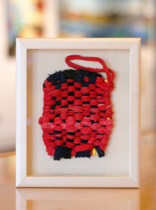 Fiber art in neutral shadow box frame