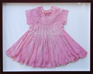 Custom framed shadow box for a hand made children's dress