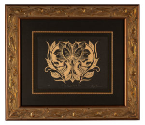 Heart and skull lino print with ornate gold frame